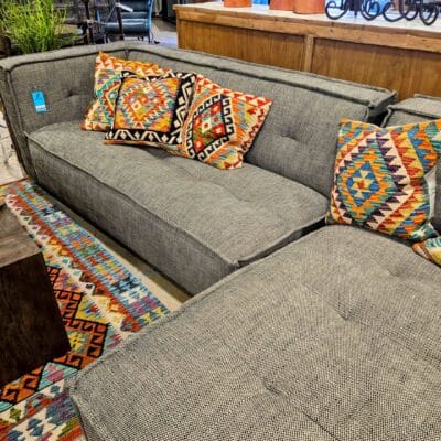 gray plaid sofa with noor pillows